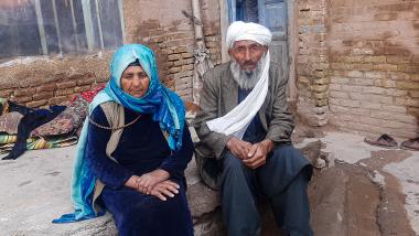 Afghan couple Abdul (80) and Halima (75) fled Shindand District to Herat due to conflict and lack of food.