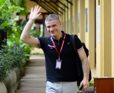 A photograph of Marco De Ponte waving to the camera